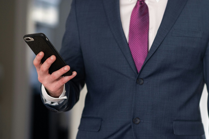 man in suit with phone