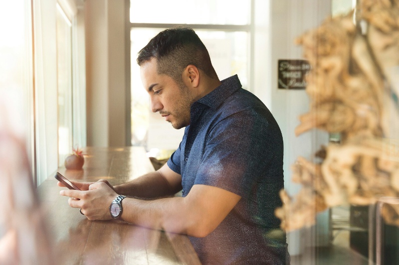 man on phone in cafe